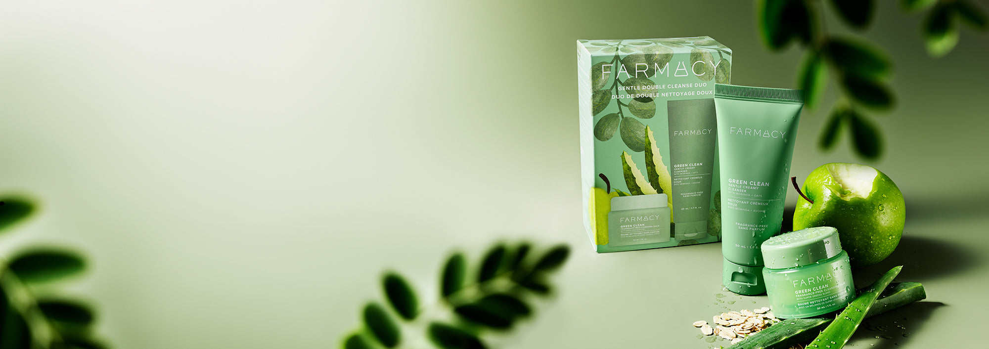 Farmacy Green Clean skincare products including a jar, tube, and box on a green background
