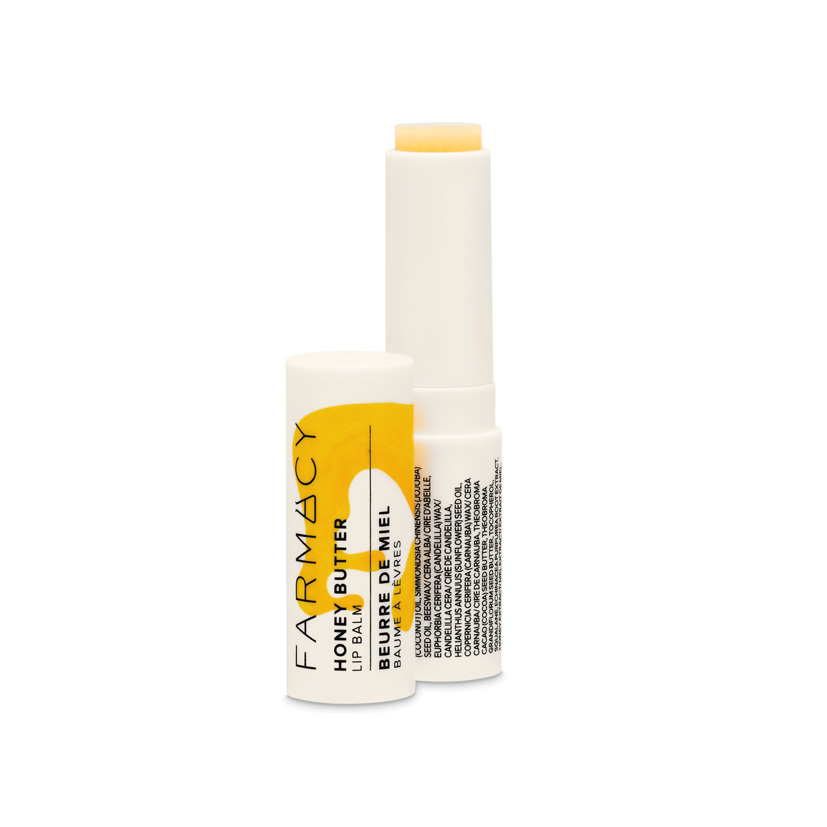 3.4g tube of Farmacy Honey Butter Lip Balm on white background