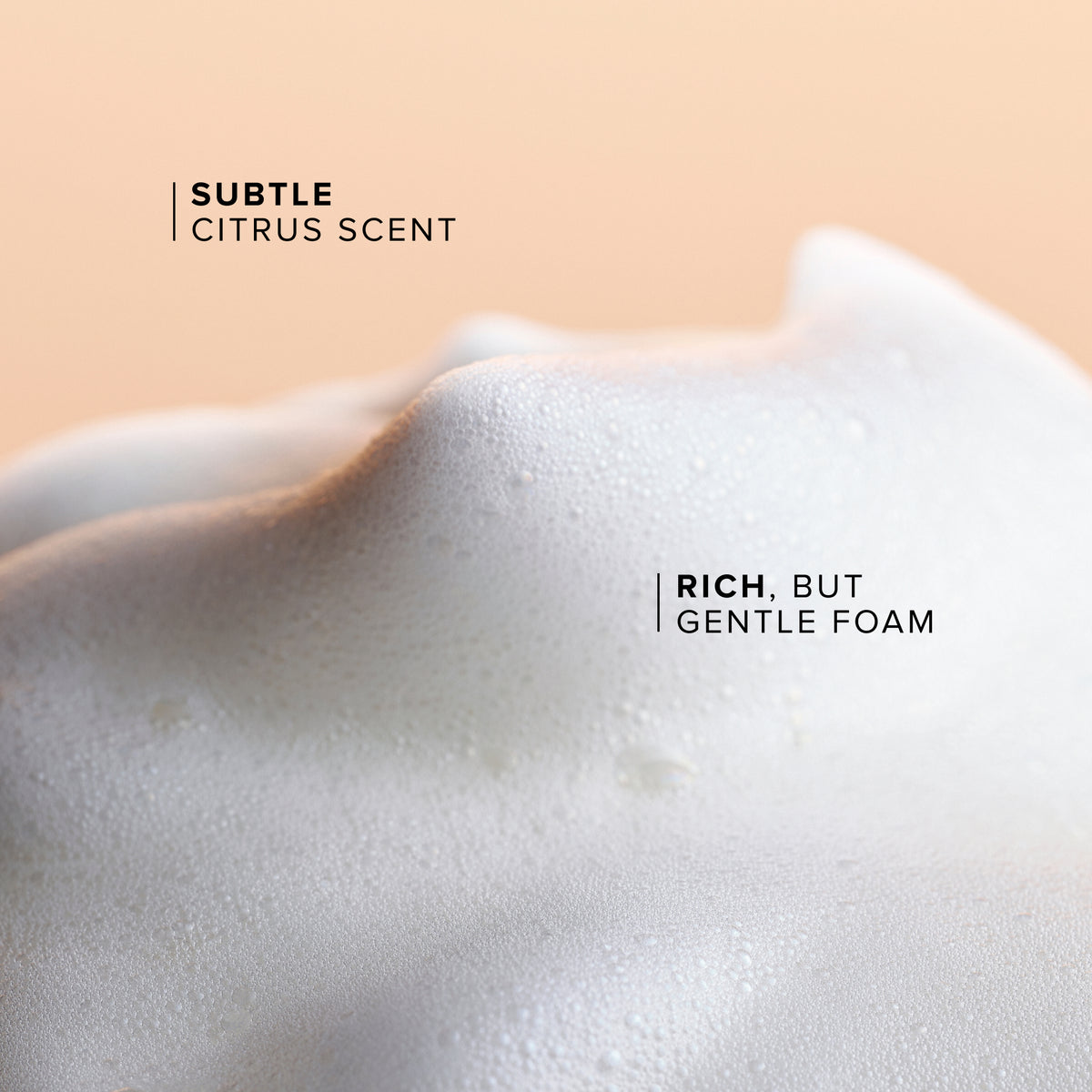 Close-up of rich, but gentle foam with text on a peach background